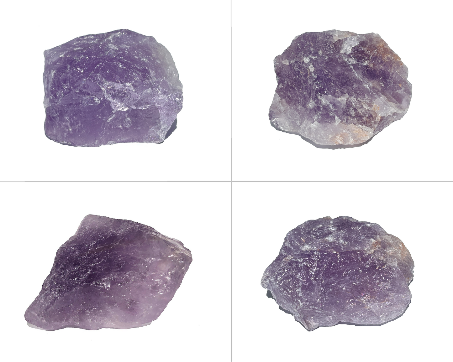 Amethyst Rohsteine zweireihig nebeneinander angeordnet auf weißem Hintergrund