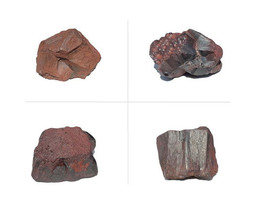 Hämatit Rohsteine zweireihig nebeneinander angeordnet auf weißem Hintergrund