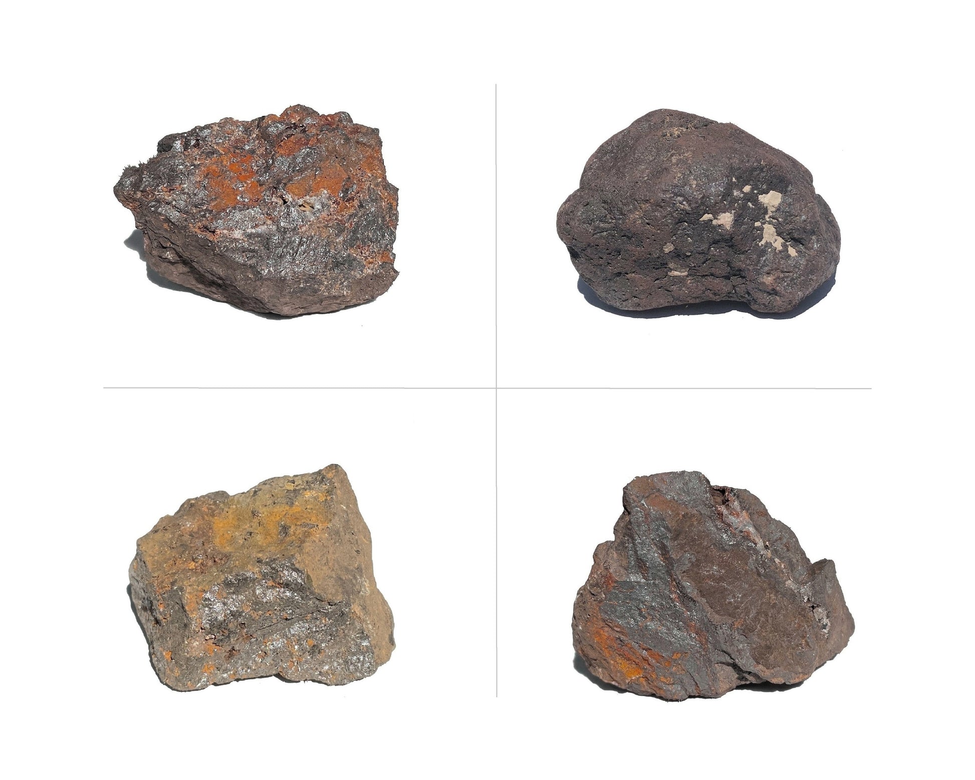 Magnetit Rohsteine zweireihig nebeneinander angeordnet auf weißem Hintergrund